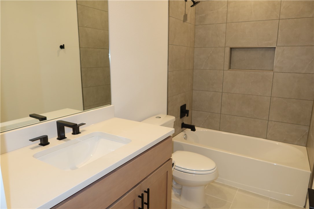 2905 Huffman Way College Station, TX 77845 - Photo 27 of 37 a bathroom with a sink a toilet and shower