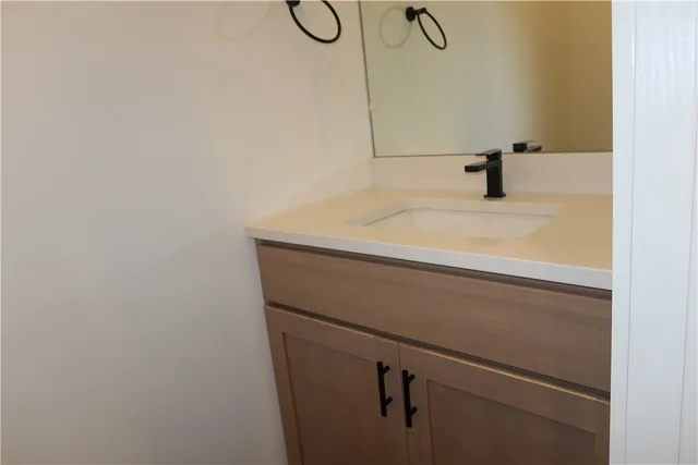 a white toilet sitting next to a sink