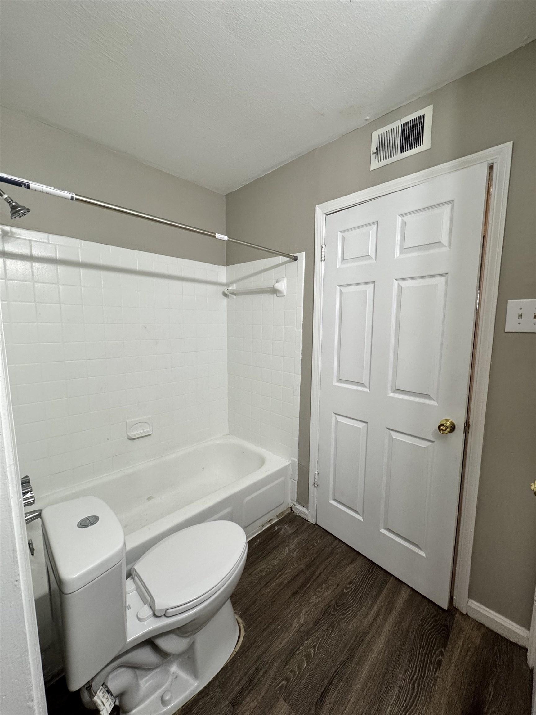 3556 Arnold Road Memphis, TN 38118 - Photo 3 of 3 a bathroom with a toilet a sink and bathtub