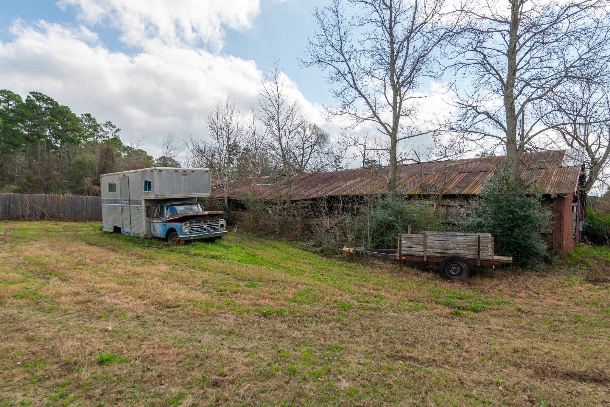 25503 Hufsmith Cemetery Road Tomball, TX 77375 - Photo 14 of 24 a backyard of a house with table and chairs
