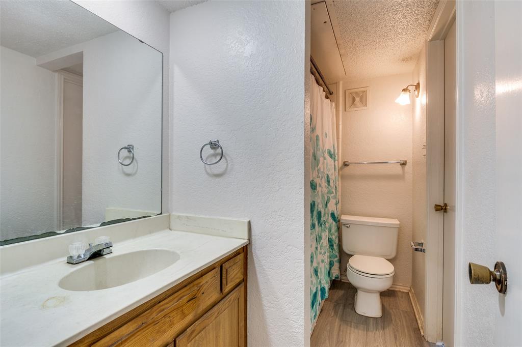 1913 San Rafael Street Fort Worth, TX 76134 - Photo 11 of 12 a bathroom with a sink toilet and shower