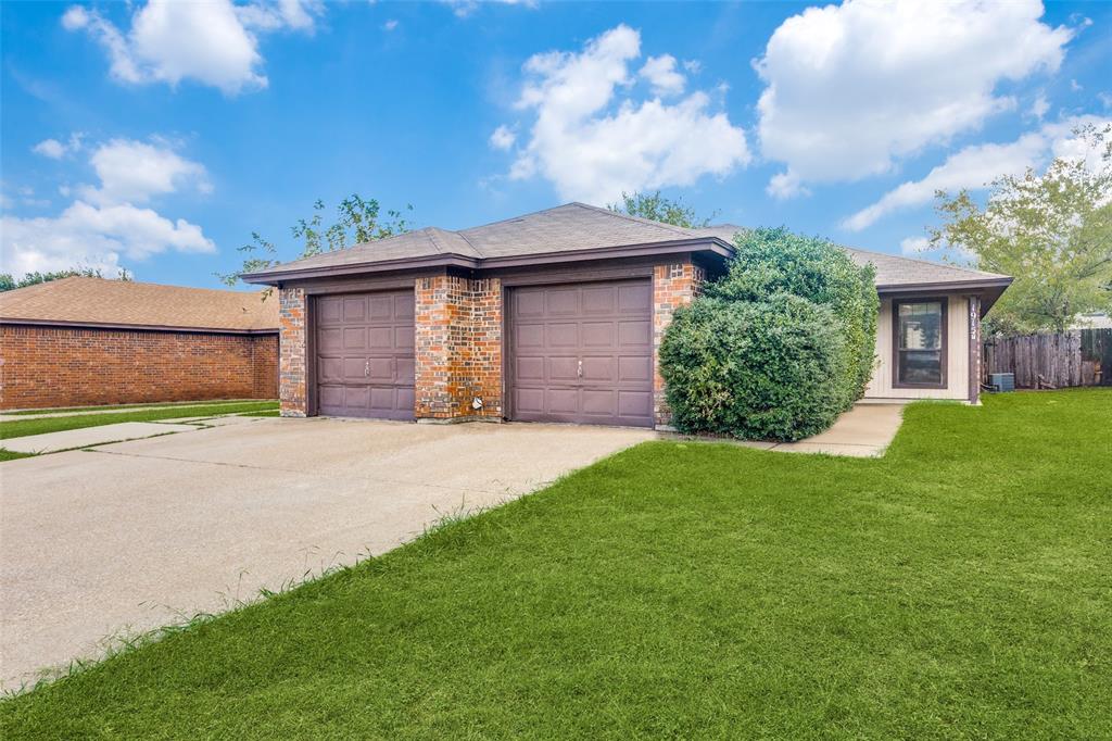 1913 San Rafael Street Fort Worth, TX 76134 - Photo 2 of 12 a front view of a house with a garden
