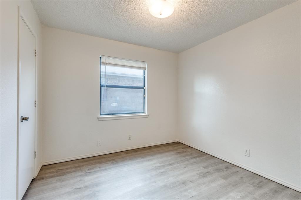 1913 San Rafael Street Fort Worth, TX 76134 - Photo 7 of 12 an empty room with a window