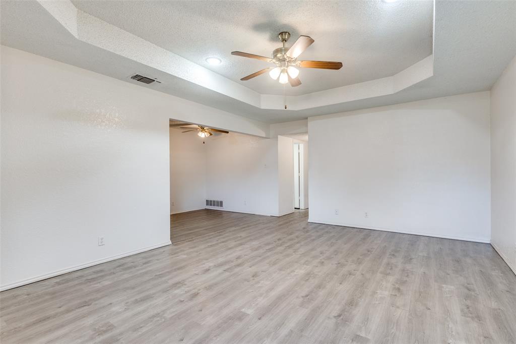 1913 San Rafael Street Fort Worth, TX 76134 - Photo 8 of 12 wooden floor in an empty room