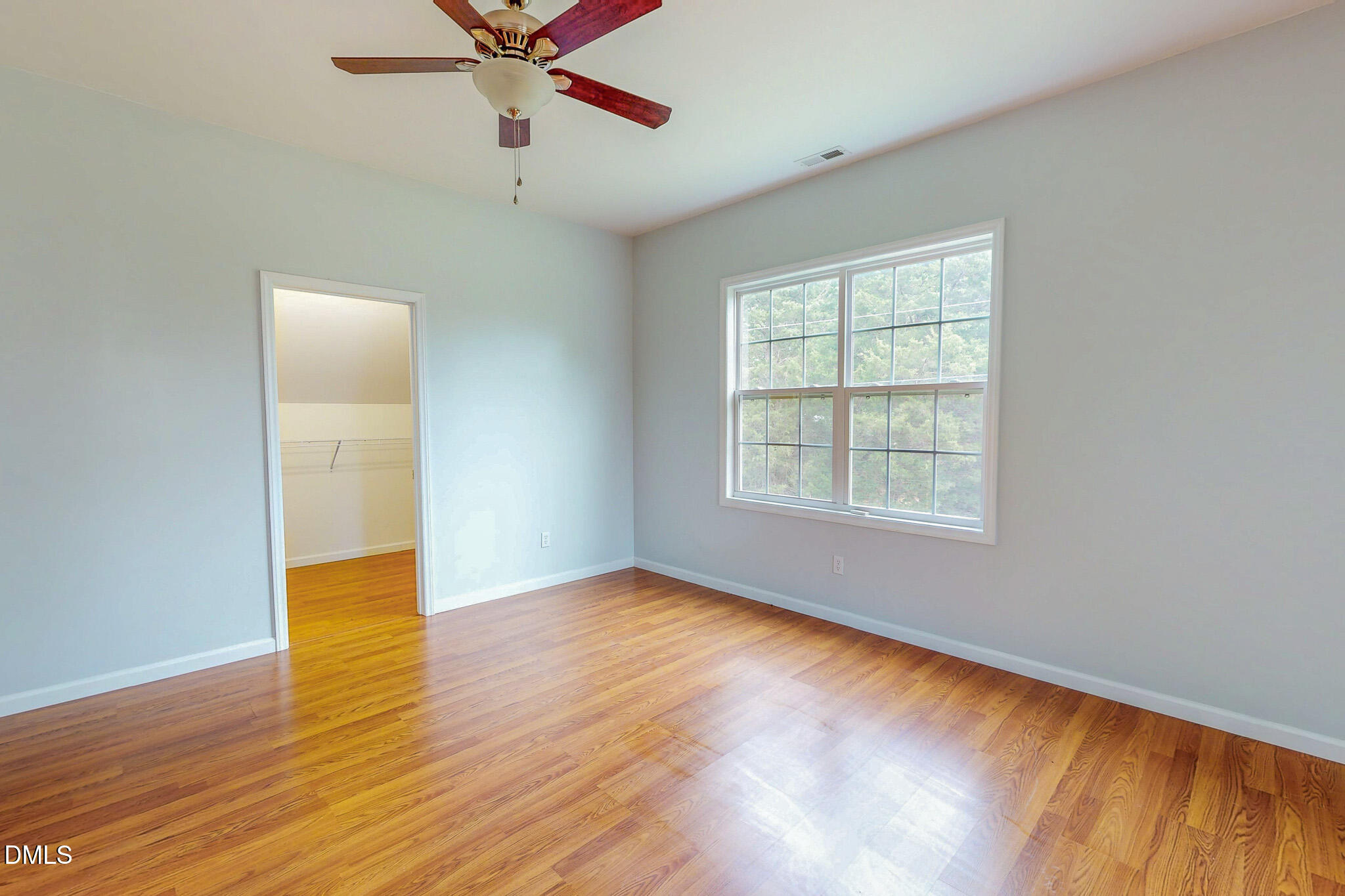 471 Parham Road Roxboro, NC 27574 - Photo 47 of 92 a view of an empty room with wooden floor and a window