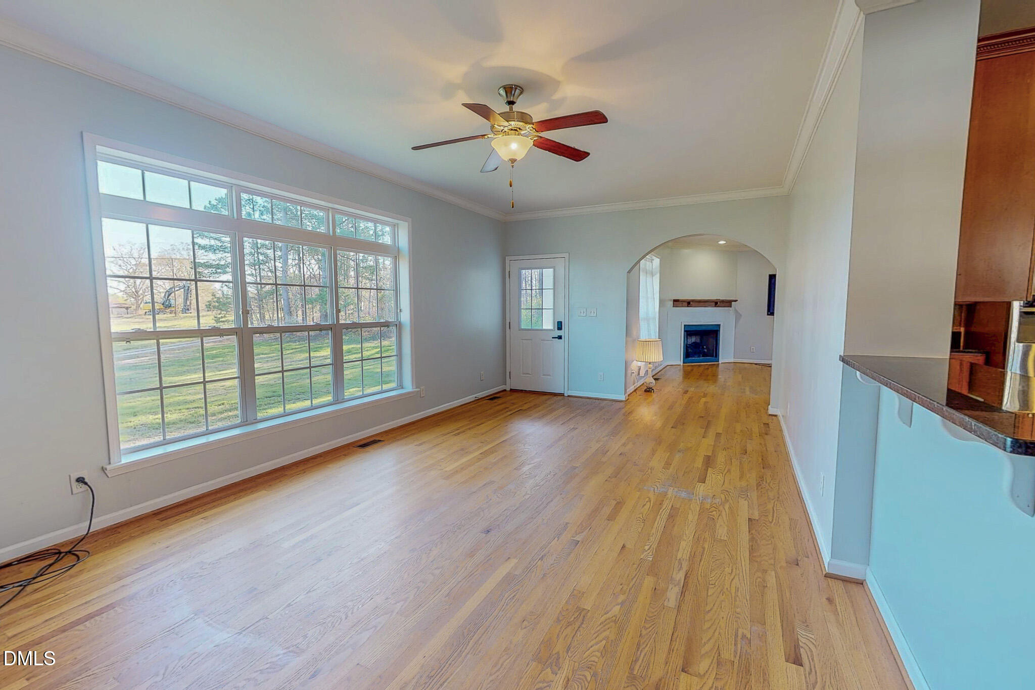 471 Parham Road Roxboro, NC 27574 - Photo 5 of 92 a view of a room with wooden floor cabinet and a ceiling fan