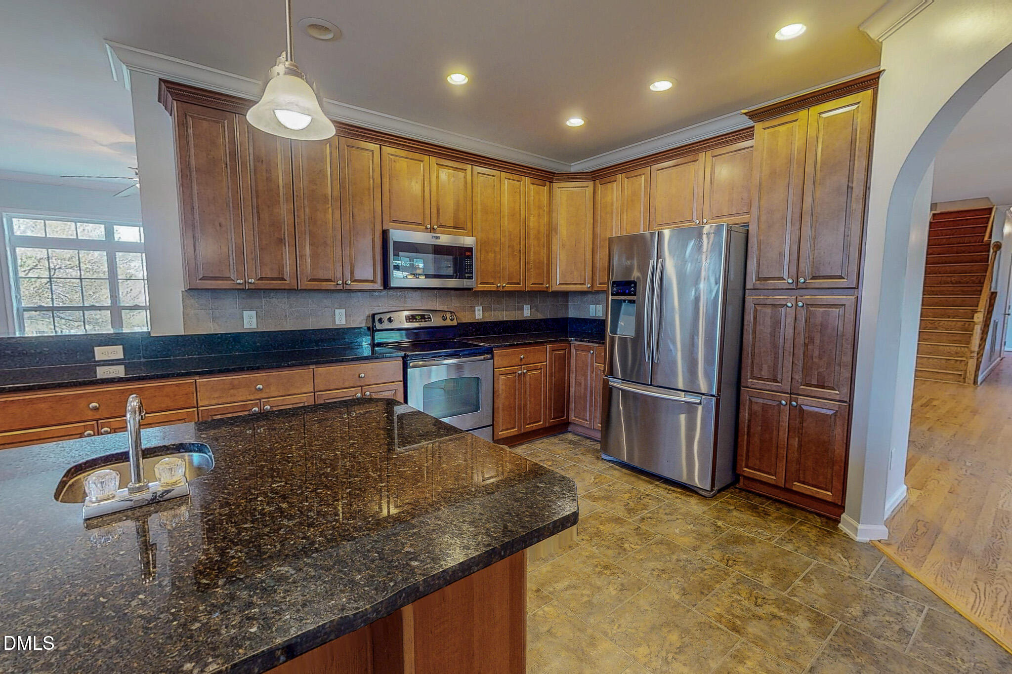 471 Parham Road Roxboro, NC 27574 - Photo 54 of 92 a kitchen with stainless steel appliances granite countertop a sink a stove and a refrigerator