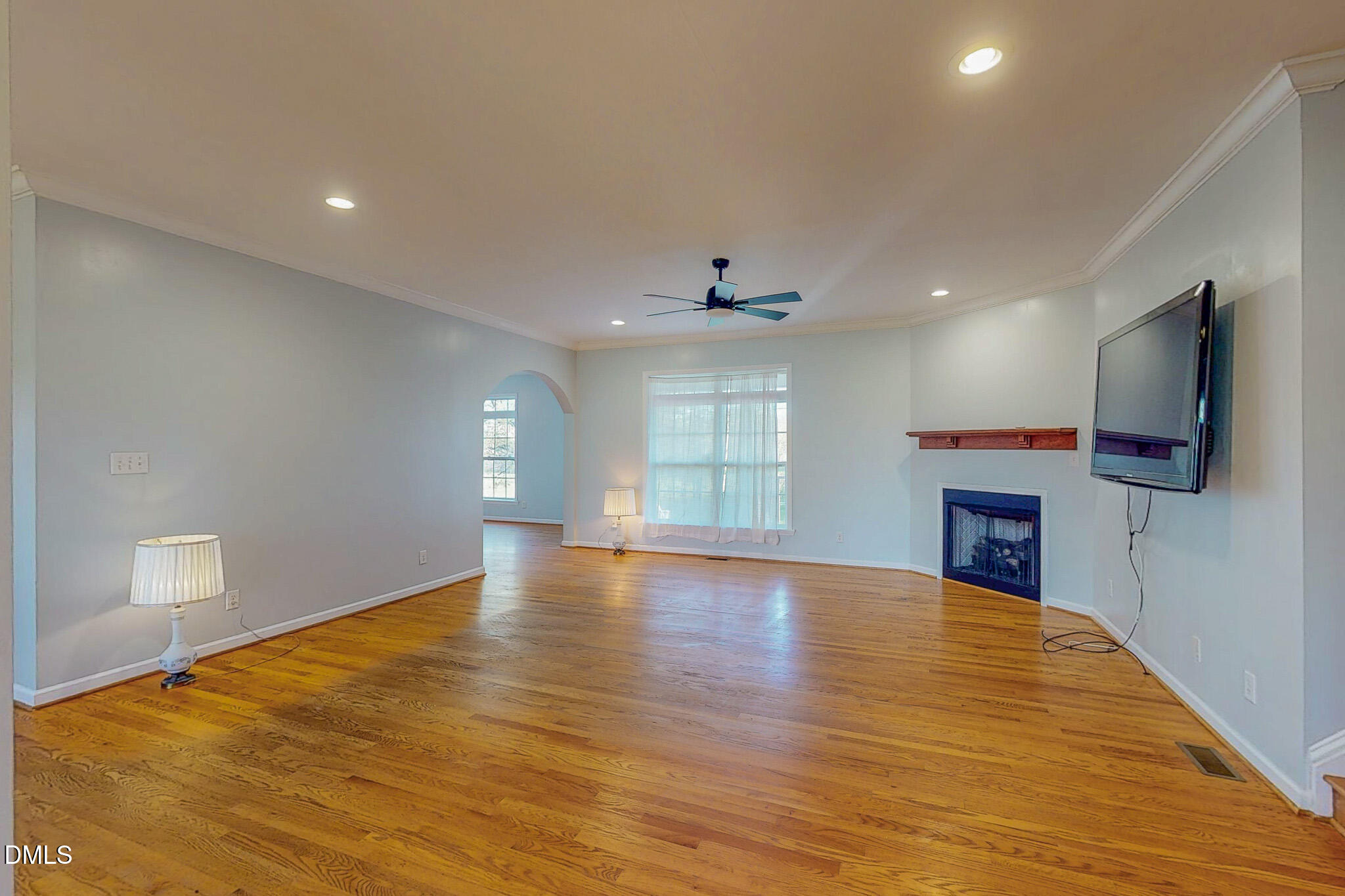 471 Parham Road Roxboro, NC 27574 - Photo 64 of 92 a view of empty room with wooden floor and fireplace
