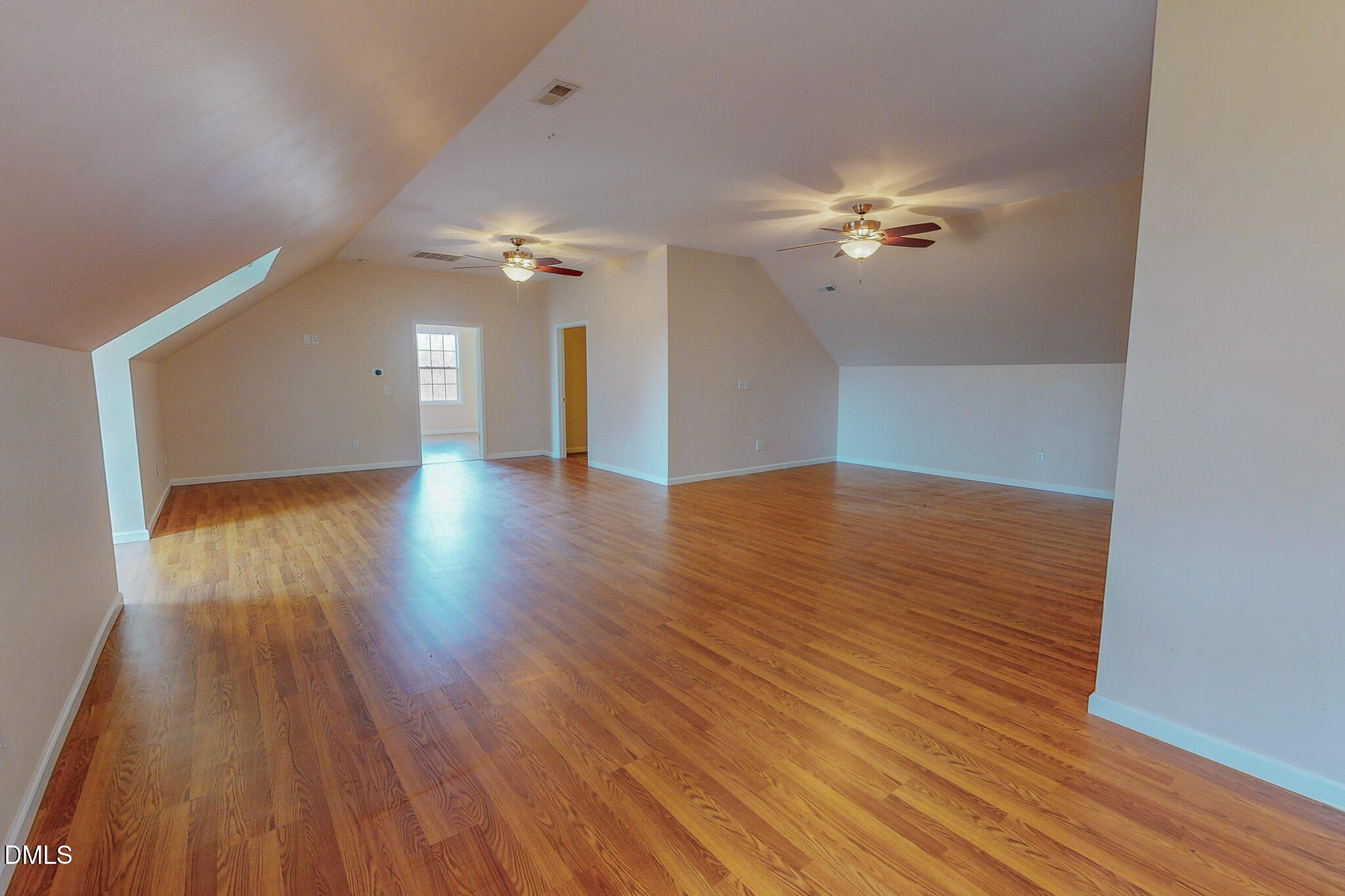 471 Parham Road Roxboro, NC 27574 - Photo 85 of 92 a view of a room with wooden floor a ceiling fan and windows