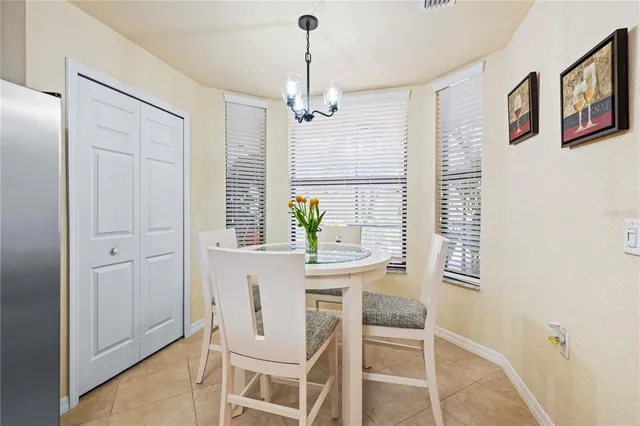 a room with a refrigerator and a sink