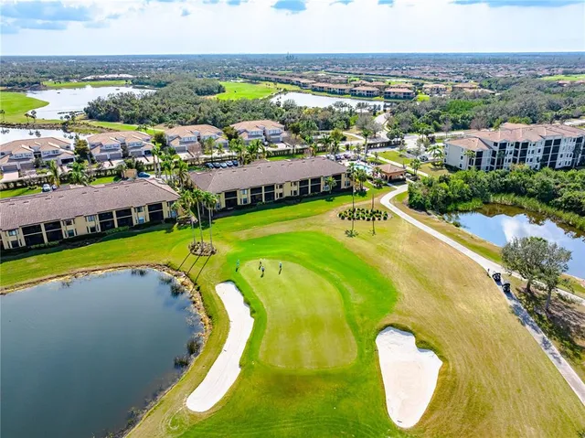 a view of a golf course with a swimming pool