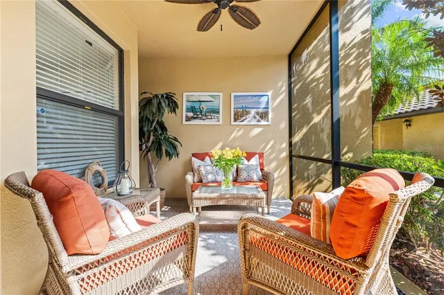 a view of a dining room and livingroom with furniture wooden floor a chandelier