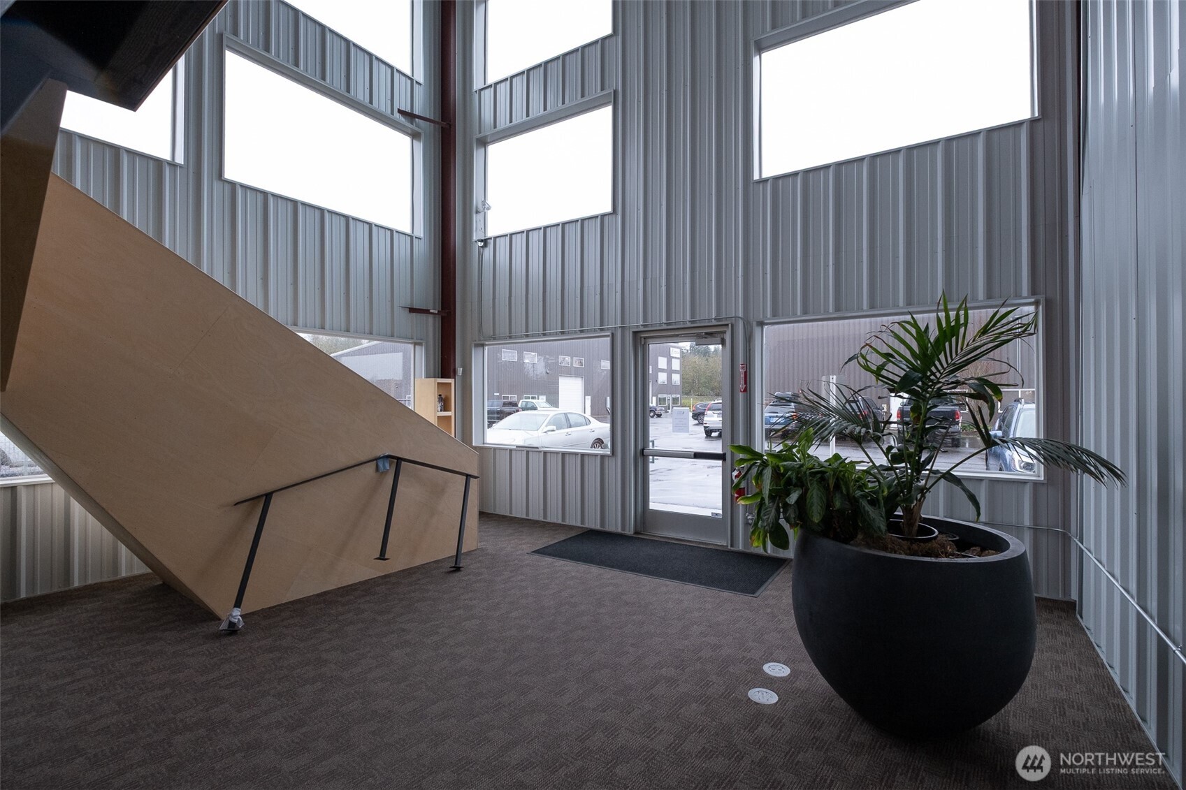 12375 Reservation Road Anacortes, WA 98221 - Photo 12 of 40 a potted plant sitting in front of a house with potted plants