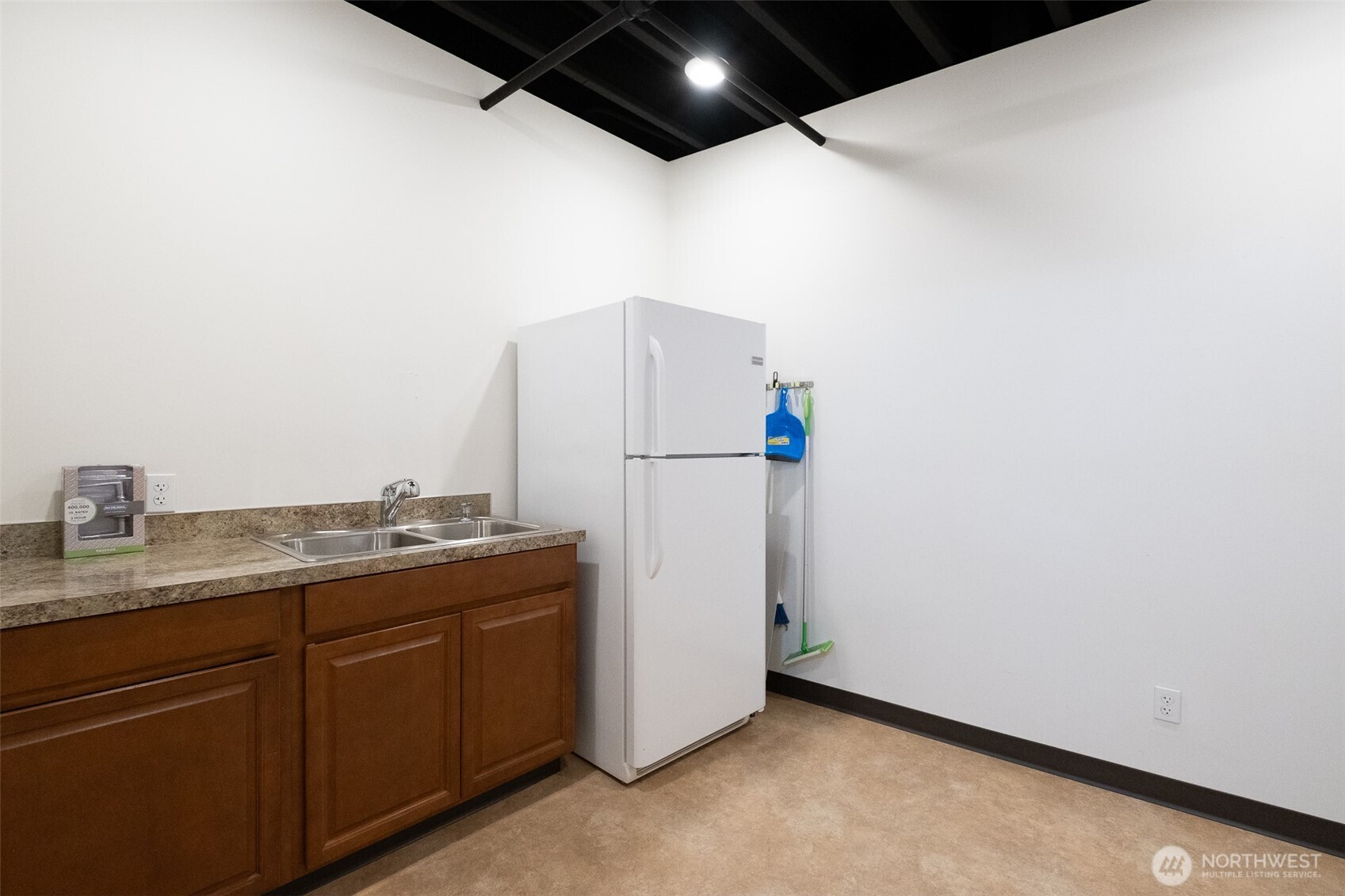 12375 Reservation Road Anacortes, WA 98221 - Photo 21 of 40 a utility room with granite countertop cabinets and washer