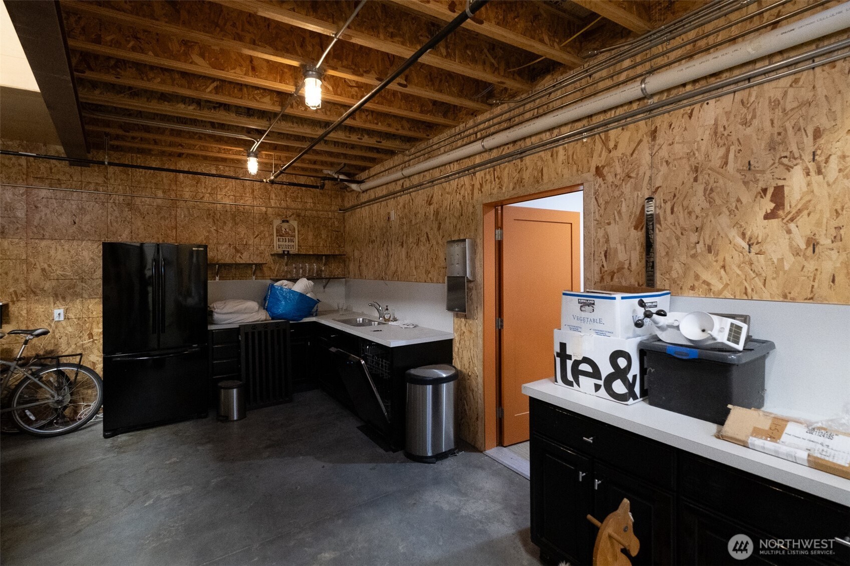 12375 Reservation Road Anacortes, WA 98221 - Photo 33 of 40 a kitchen with a stove and a refrigerator