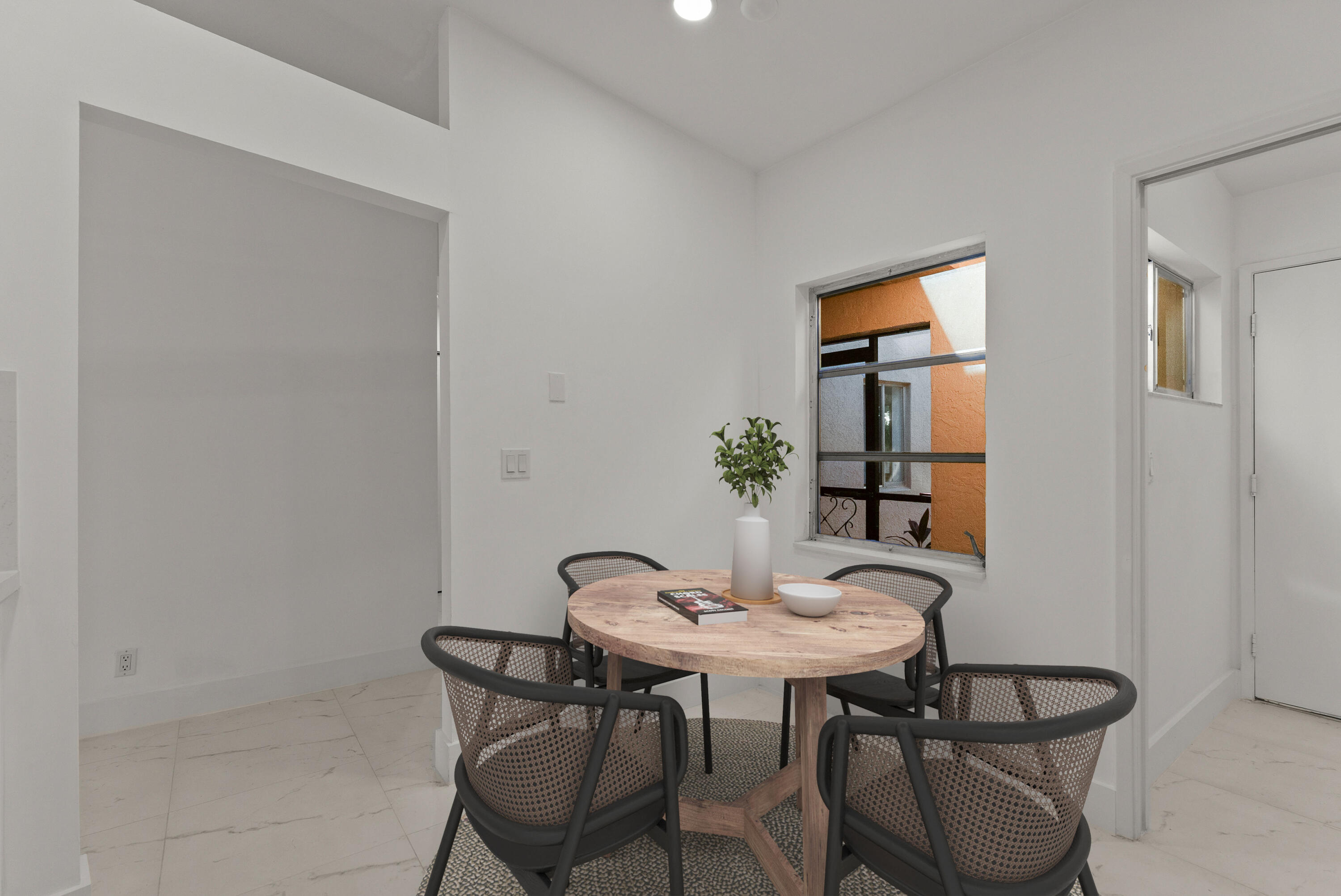 8273 Springtree Road Boca Raton, FL 33496 - Photo 17 of 36 a view of a dining room with furniture and window