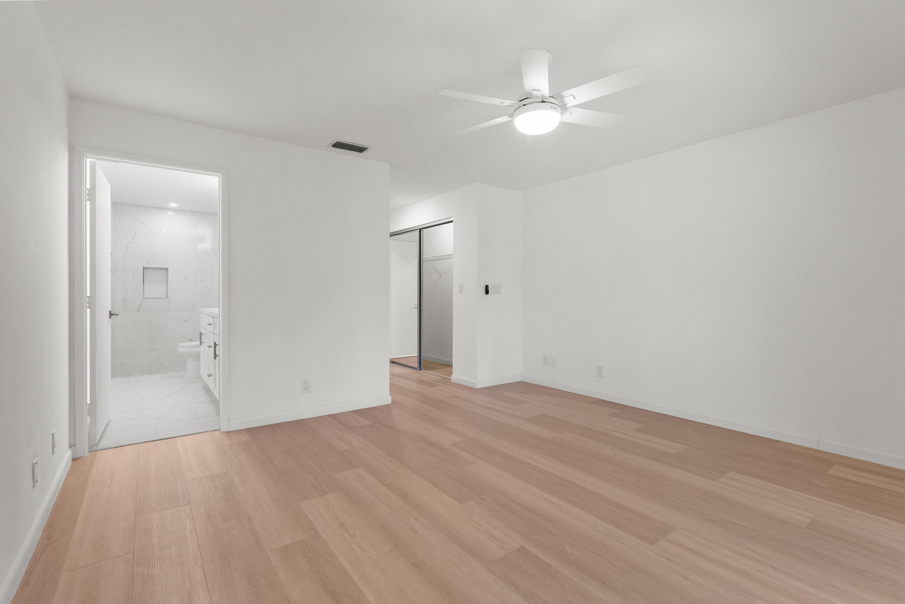 8273 Springtree Road Boca Raton, FL 33496 - Photo 24 of 36 a view of an empty room with a fan