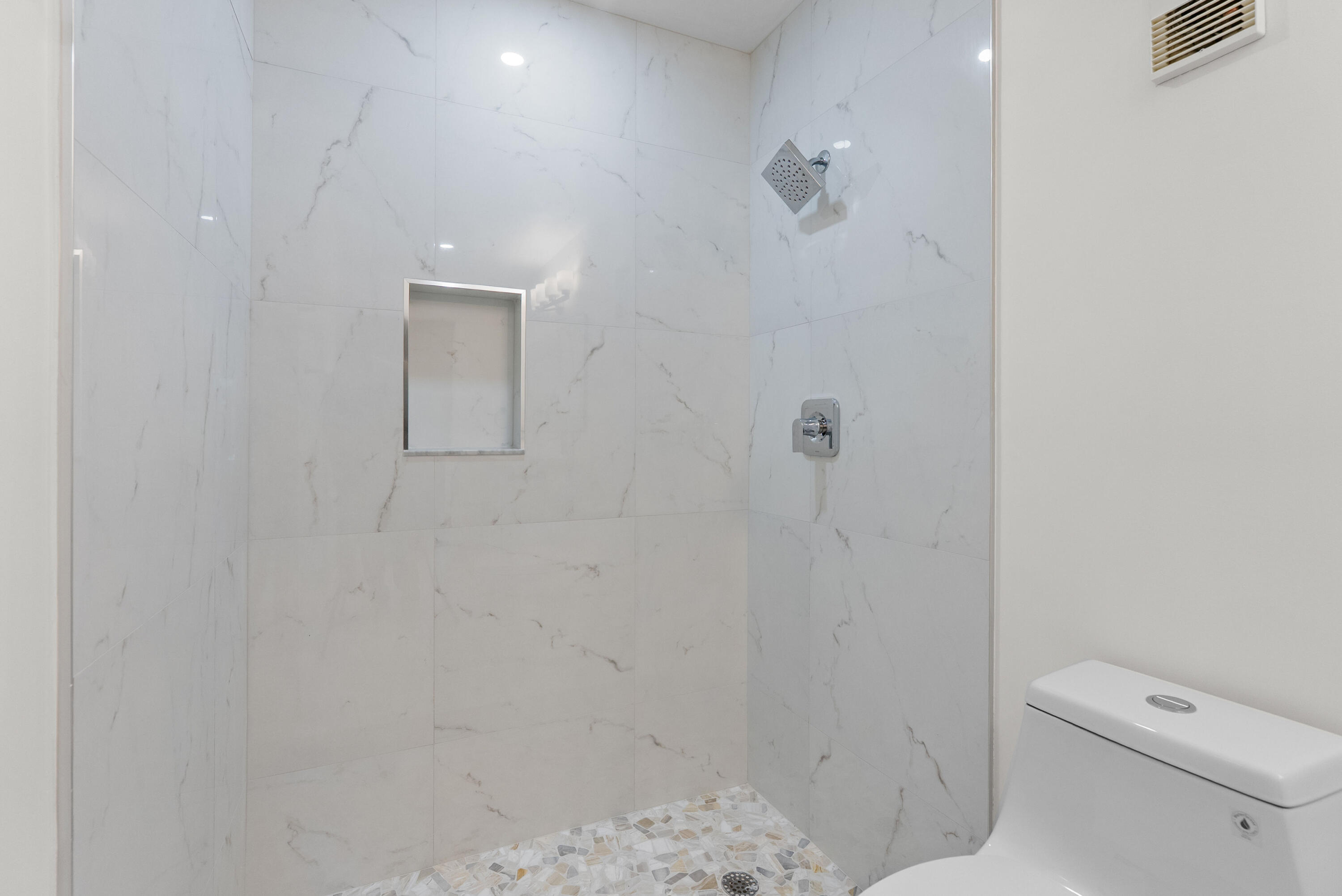 8273 Springtree Road Boca Raton, FL 33496 - Photo 25 of 36 a bathroom with a toilet and a shower