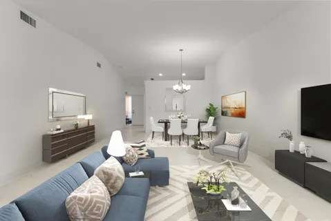 a living room with furniture a lamp and a flat screen tv