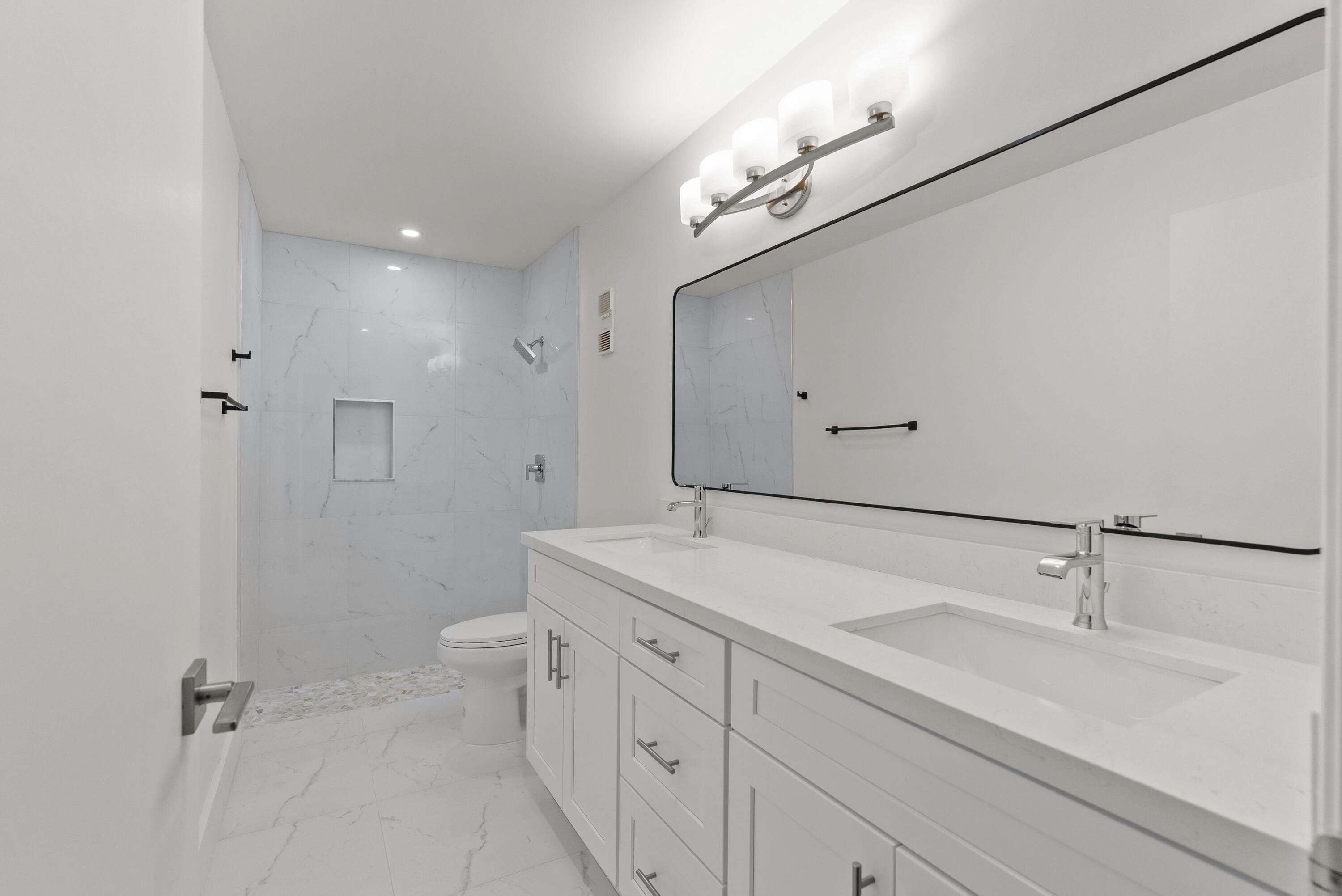 8273 Springtree Road Boca Raton, FL 33496 - Photo 6 of 36 a bathroom with a sink a toilet and shower