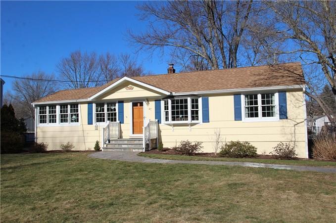 47 Farist Road Fairfield, CT 06825 - Photo 1 of 1 a front view of a house with a yard