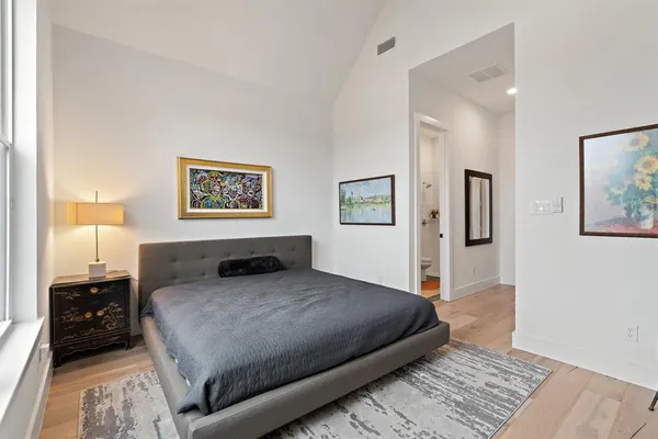 a bedroom with a bed and a walk in closet