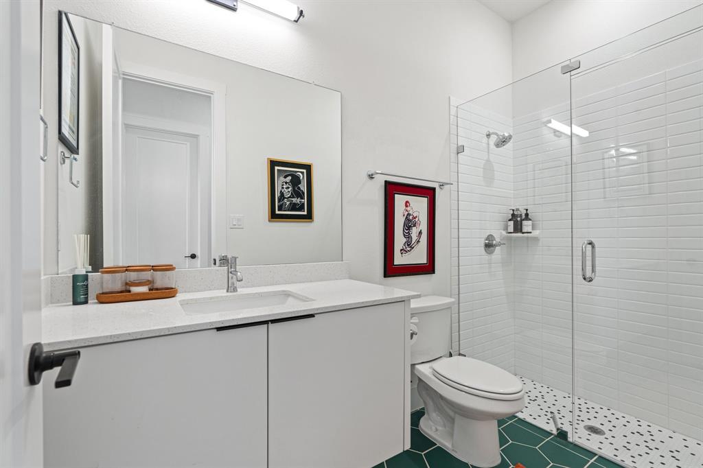 1405 Custer Court Celina, TX 75009 - Photo 18 of 40 a bathroom with a sink toilet and shower