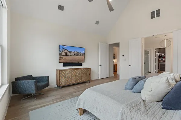 a bedroom with a bed and couch