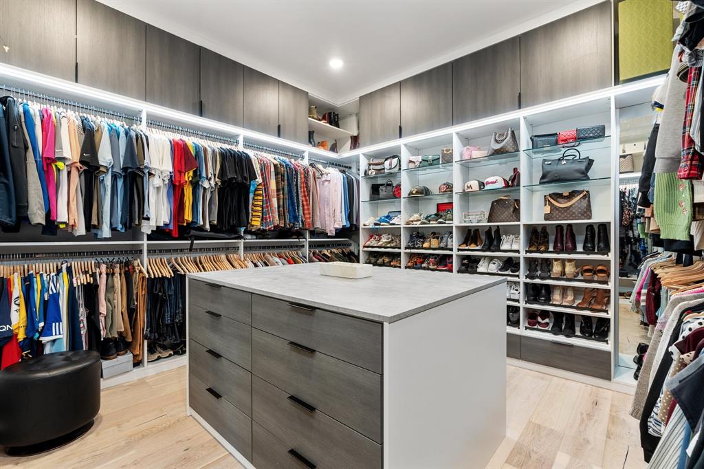 1405 Custer Court Celina, TX 75009 - Photo 23 of 40 a view of walk in closet with clothes and shoes