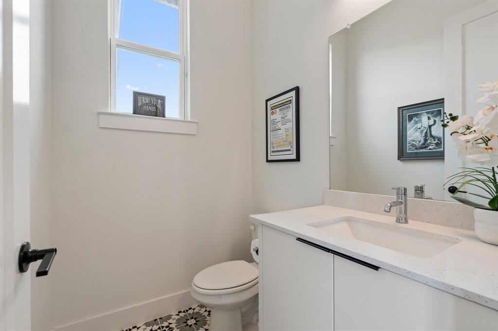 1405 Custer Court Celina, TX 75009 - Photo 25 of 40 a bathroom with a sink and a toilet