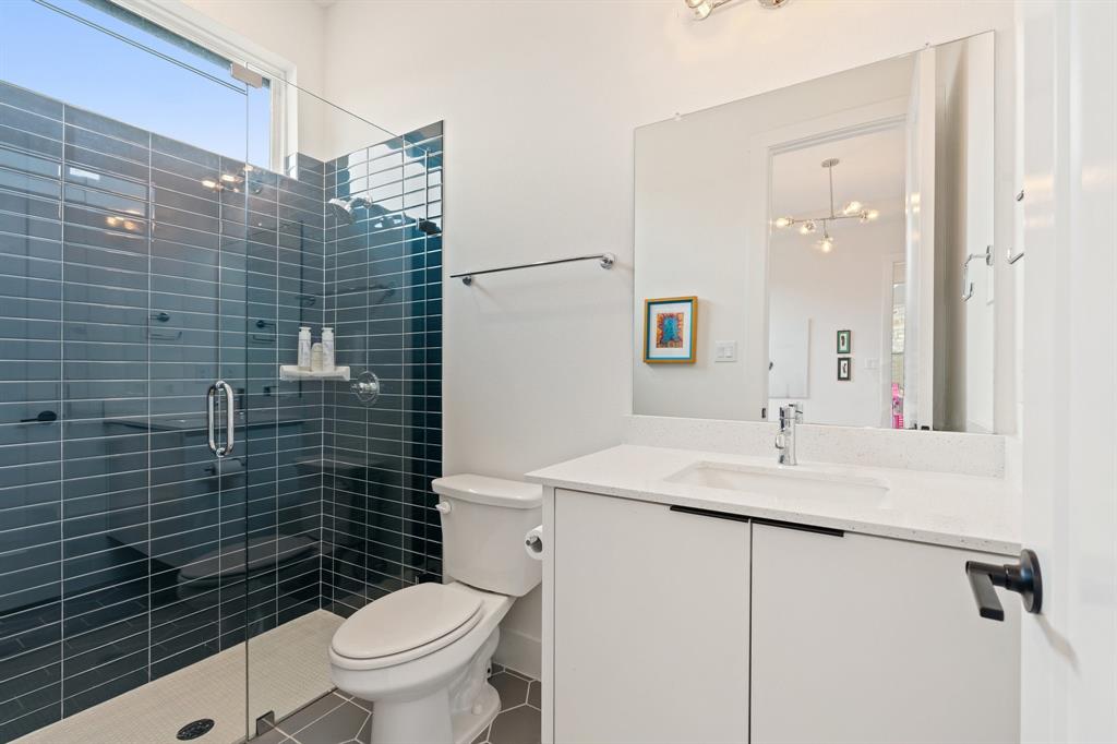 1405 Custer Court Celina, TX 75009 - Photo 30 of 40 a bathroom with a sink a toilet and shower