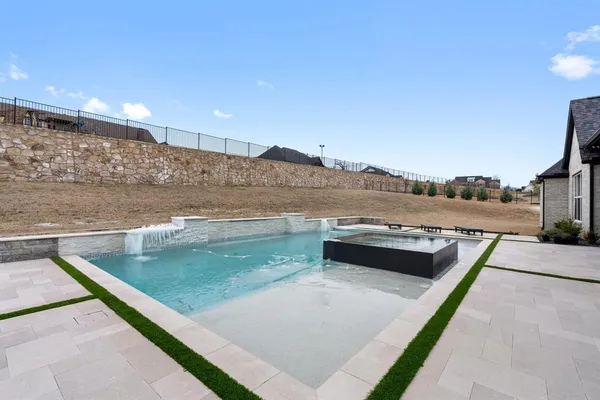 a view of a swimming pool with a terrace