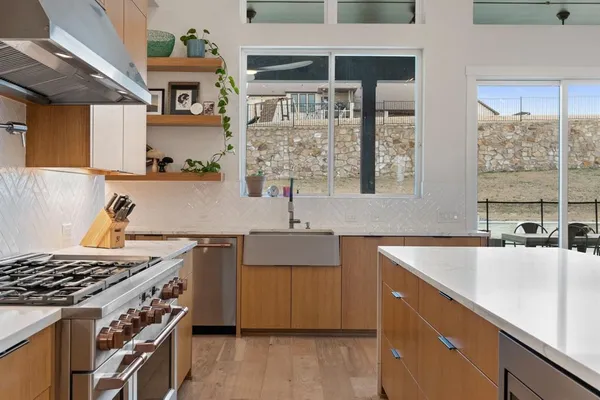 a kitchen with a stove and a sink