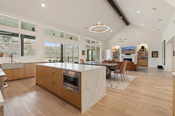 a large kitchen with stainless steel appliances lots of counter top space