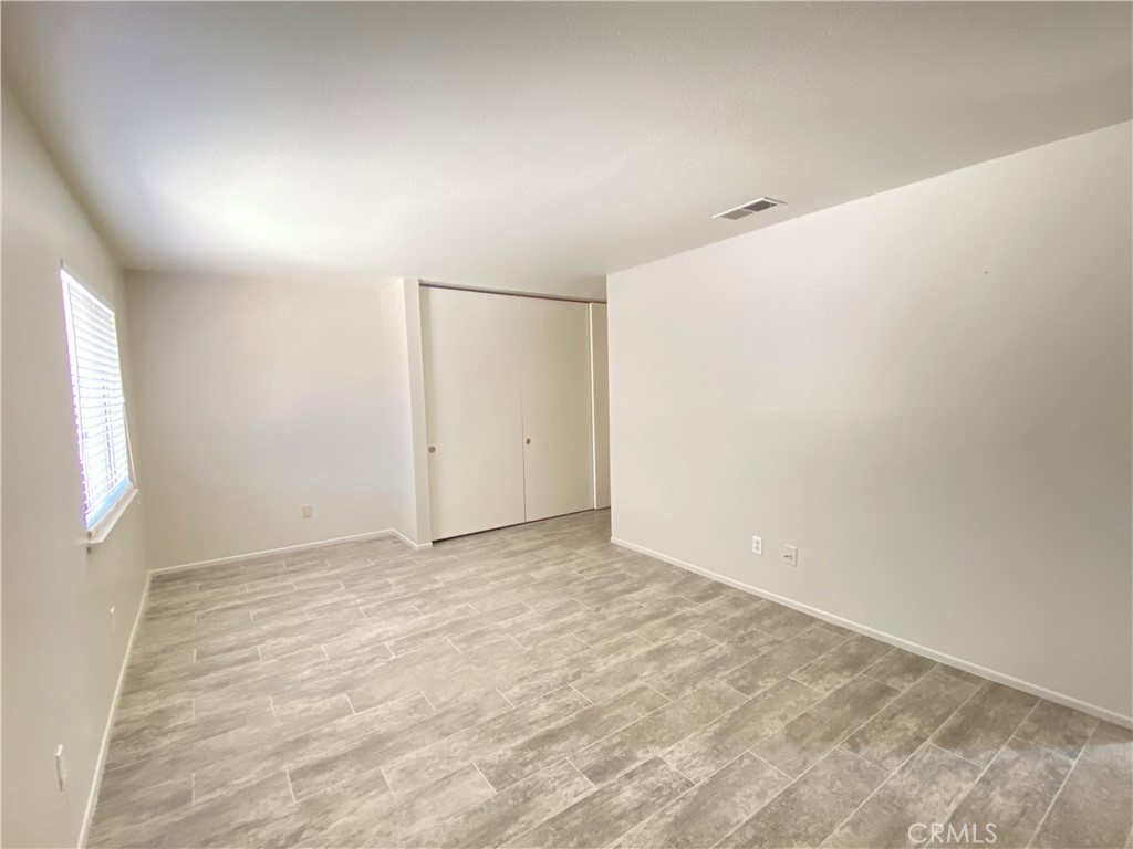 14663 Rio Grande Drive Moreno Valley, CA 92553 - Photo 14 of 15 an empty room with windows