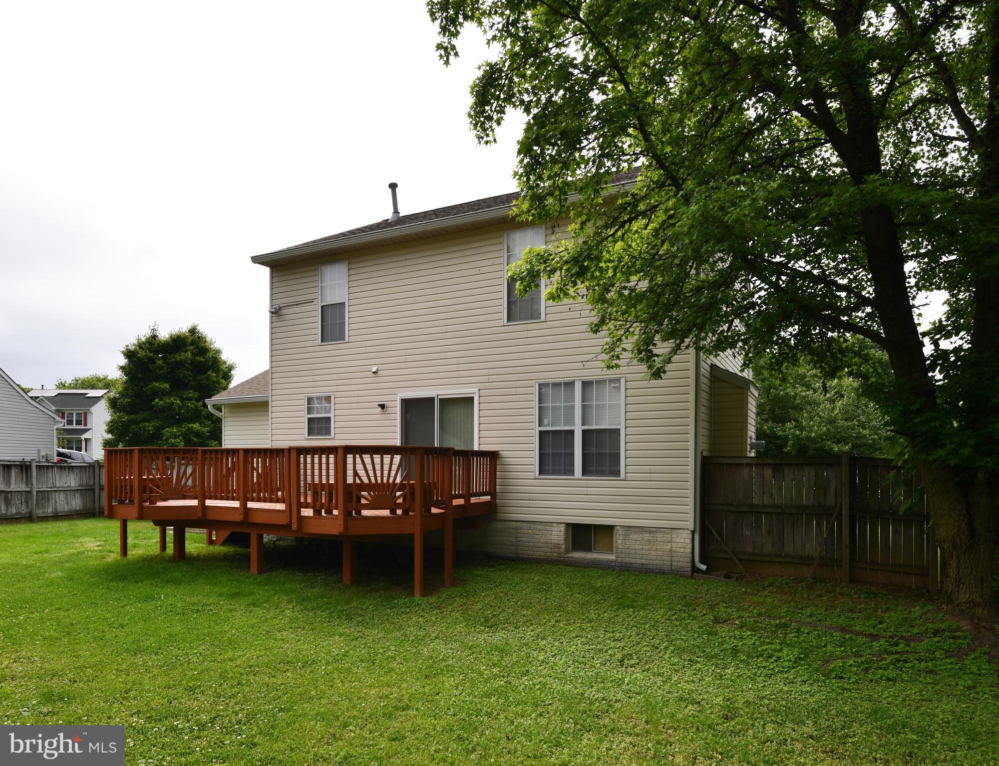 7104 Friendship Road Clinton, MD 20735 - Photo 13 of 29 Shade trees, level fenced yard. Install a pool.