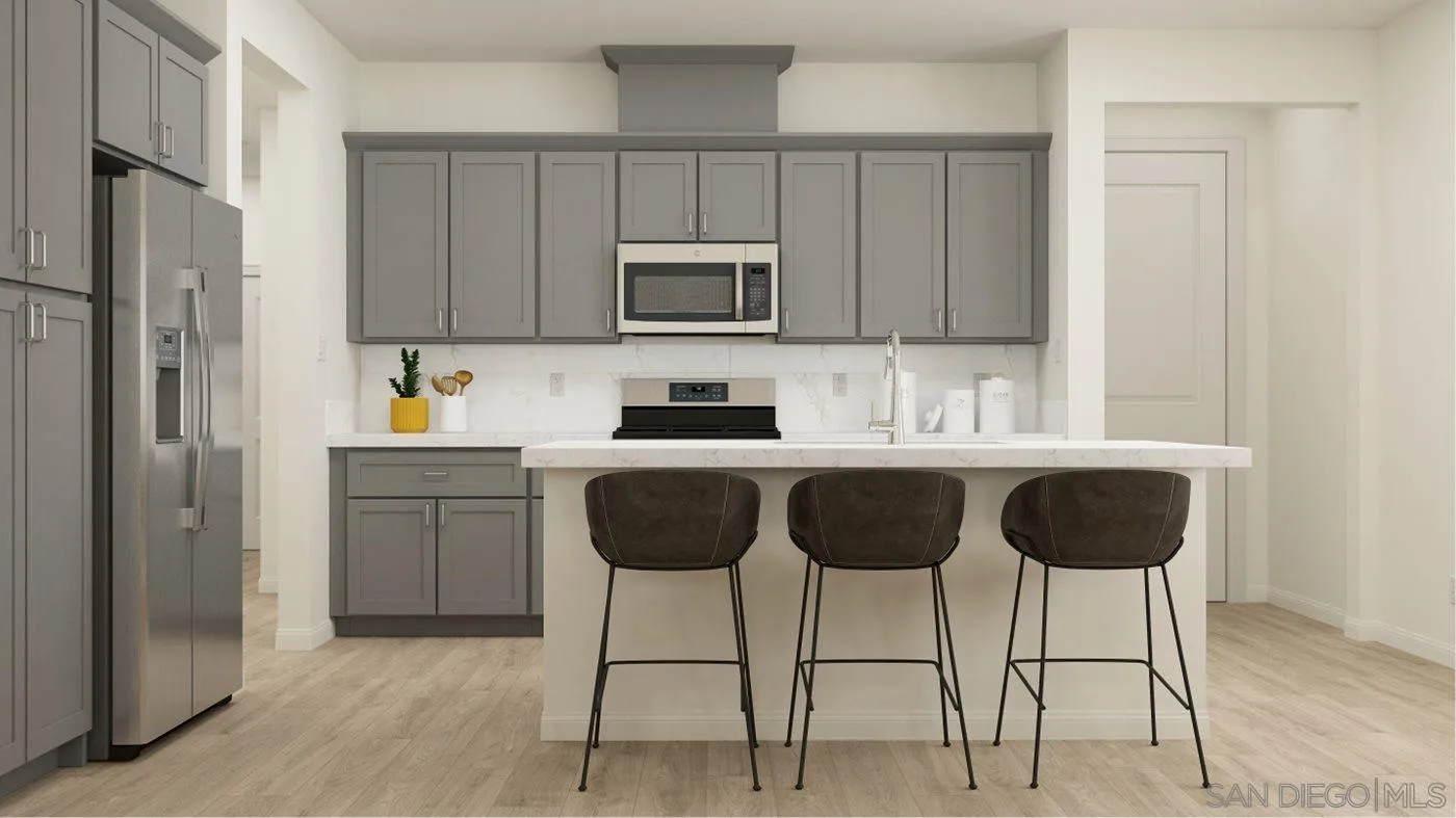 17254 Abbey Road Poway, CA 92064 - Photo 5 of 23 a kitchen with a refrigerator and a stove top oven
