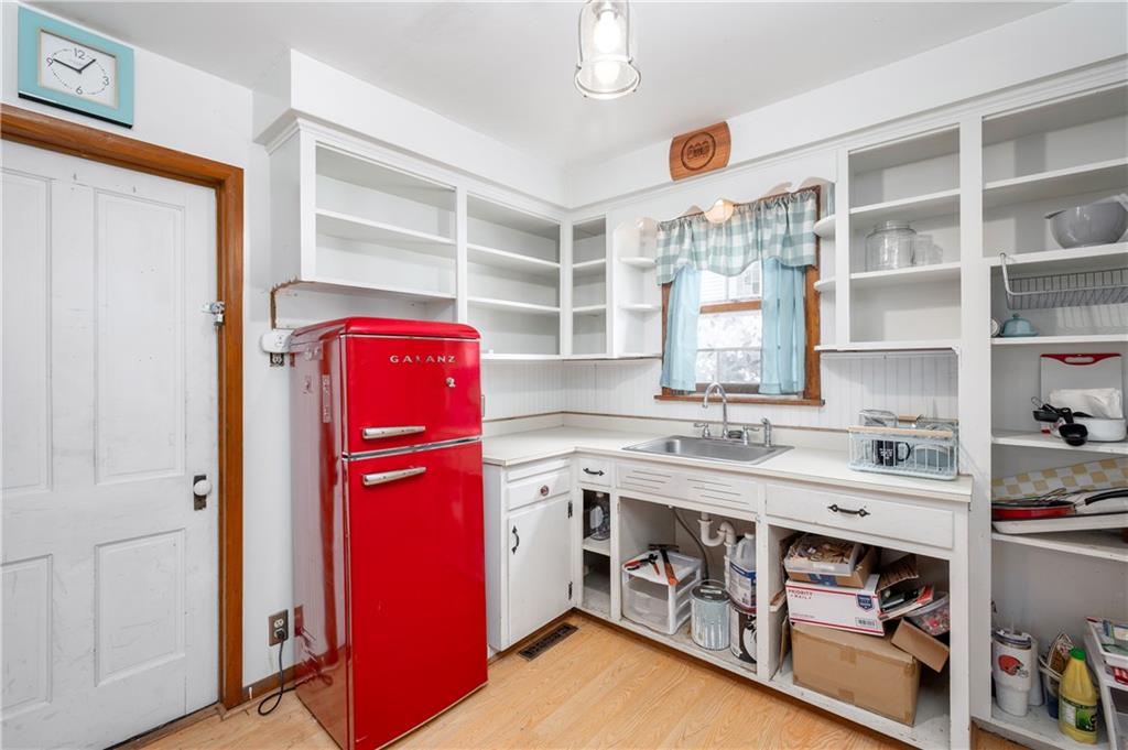375 Main Street Volant, PA 16156 - Photo 15 of 34 a utility room with stainless steel appliances cabinets and a window