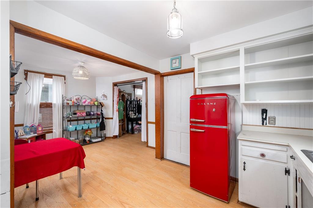 375 Main Street Volant, PA 16156 - Photo 16 of 34 a living room with furniture a flat screen tv and a refrigerator