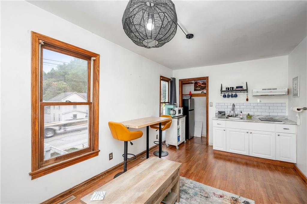 375 Main Street Volant, PA 16156 - Photo 19 of 34 a room with chandelier fan and windows