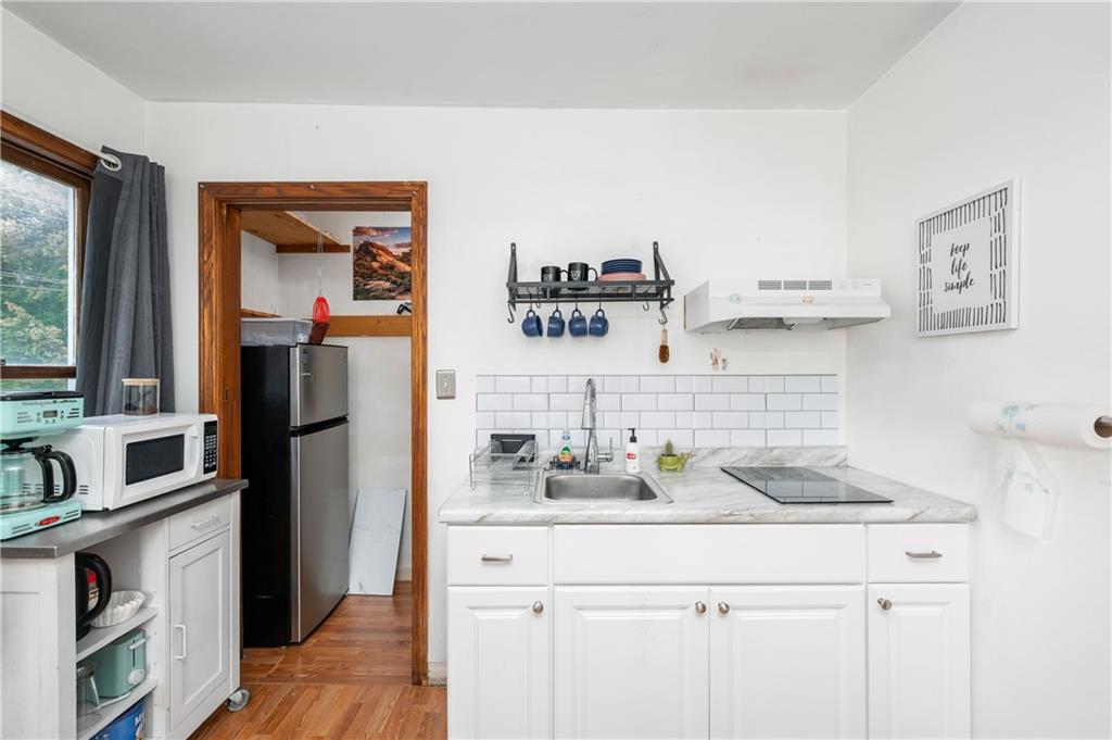375 Main Street Volant, PA 16156 - Photo 21 of 34 a kitchen with a sink cabinets and refrigerator