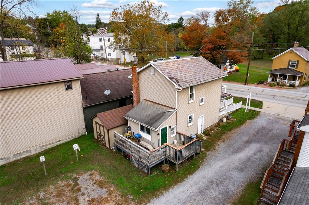 375 Main Street Volant, PA 16156 - Photo 25 of 34 a aerial view of a house with a yard table and chairs