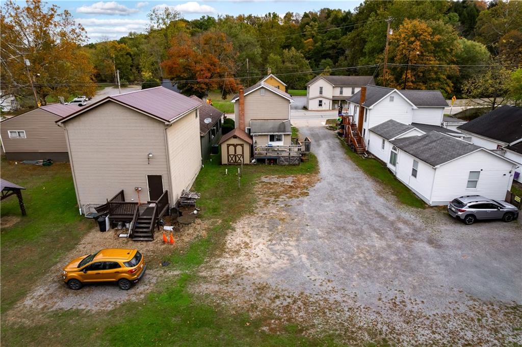 375 Main Street Volant, PA 16156 - Photo 27 of 34 a car parked in front of a house with cars parked