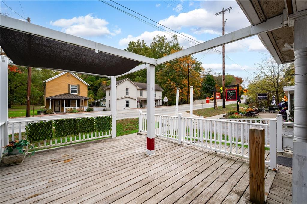 375 Main Street Volant, PA 16156 - Photo 4 of 34 a view of a deck with wooden floor and fence