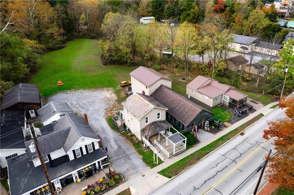 375 Main Street Volant, PA 16156 - Photo 5 of 34 an aerial view of a house with garden space and street view