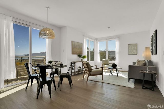 a view of a livingroom with furniture and window