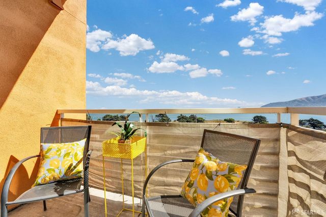 a view of a swimming pool with a lounge chairs