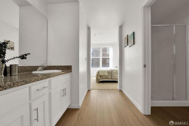 a en suite bathroom with a sink and a mirror
