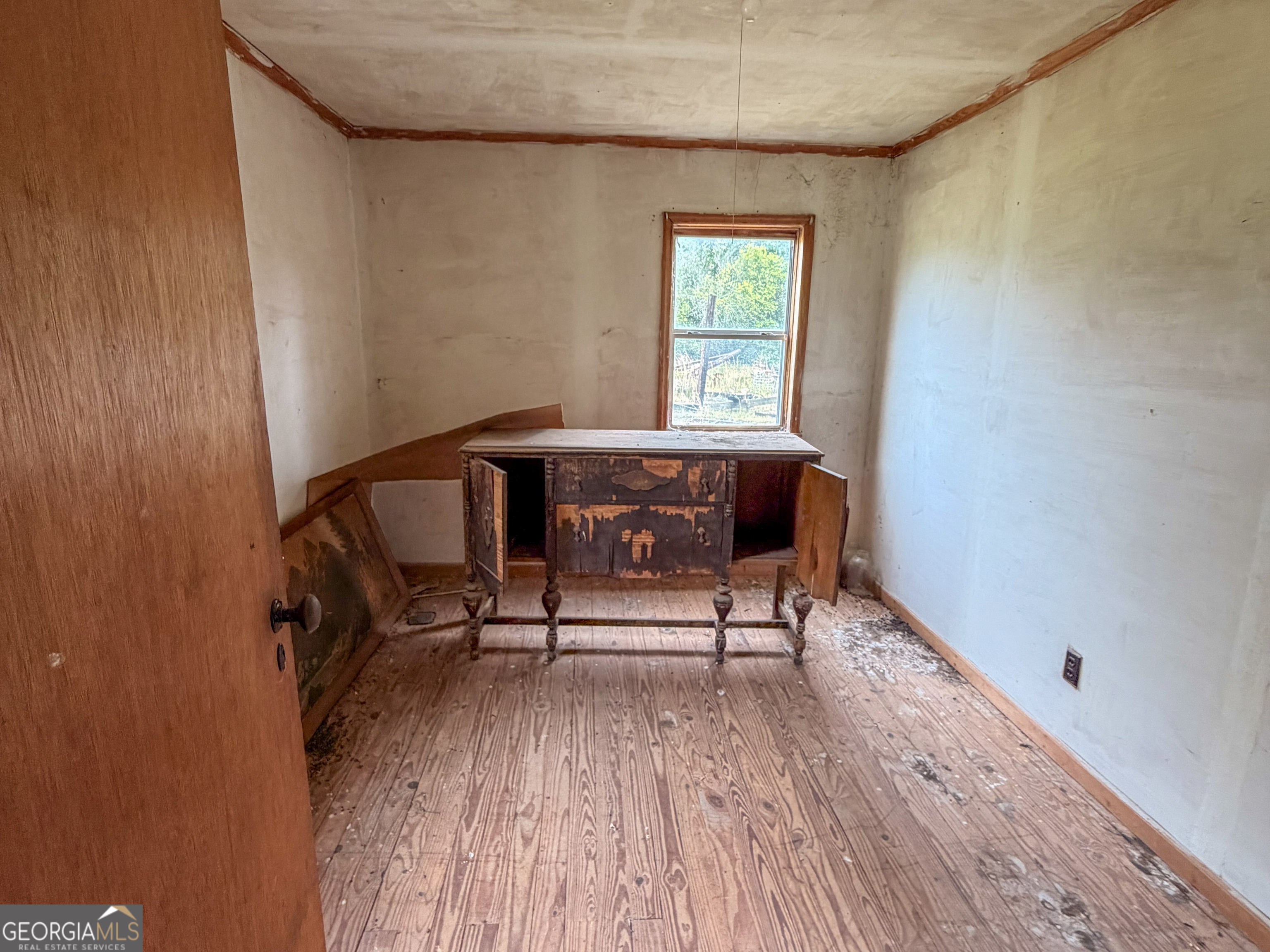 3925 Highway 441 Rentz, GA 31075 - Photo 11 of 16 a view of a workspace with furniture and a window