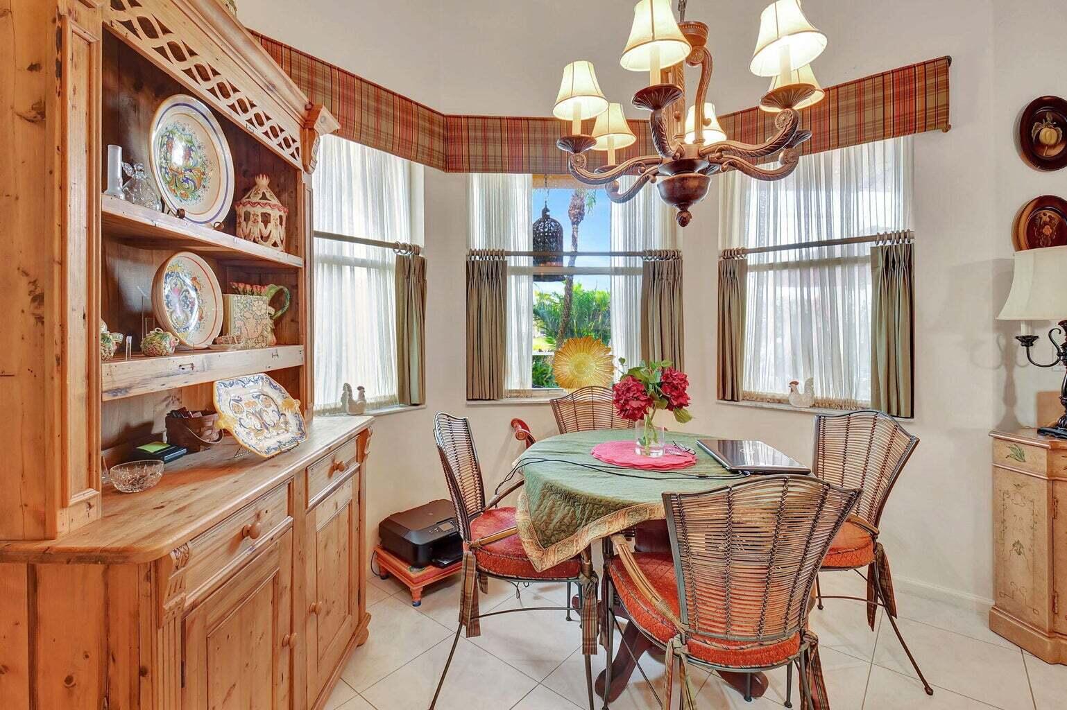 7035 Vivaldi Lane Delray Beach, FL 33446 - Photo 11 of 39 a dining room with furniture and chandelier